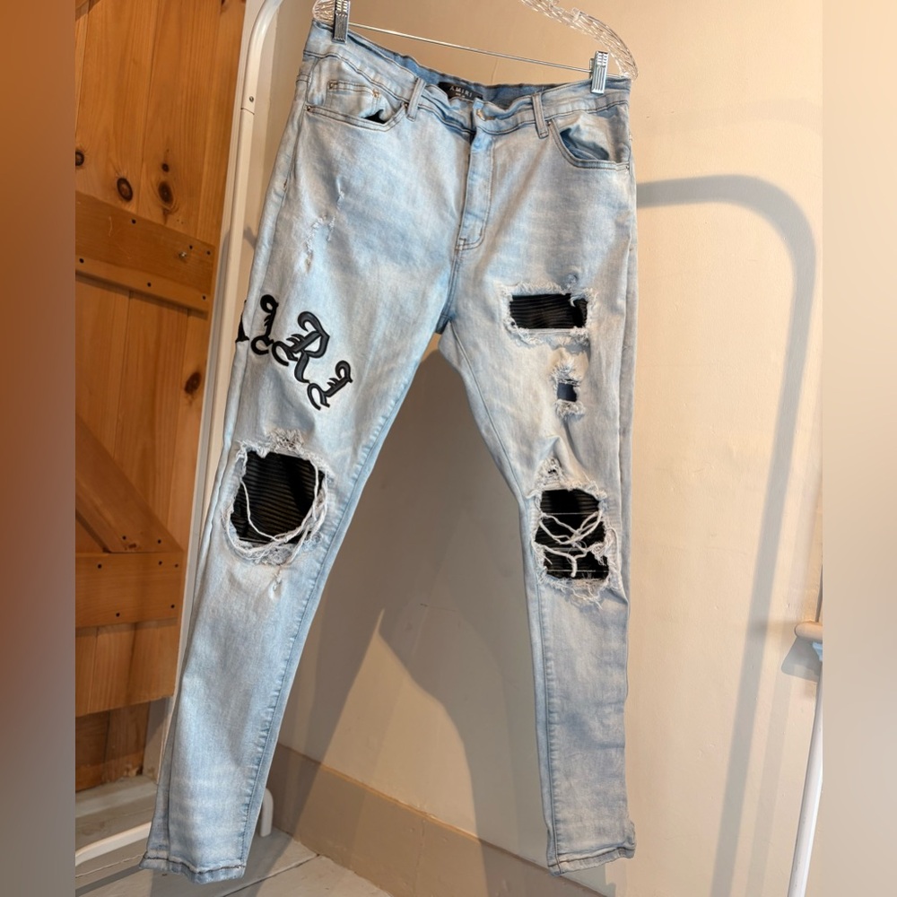 AMIRI Staggered Logo Skinny Jeans in blue denim
